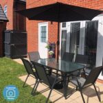 6 Seater Grey Metal Stackable Garden Dining Set with Free Parasol and Base - Fortrose - Image 11